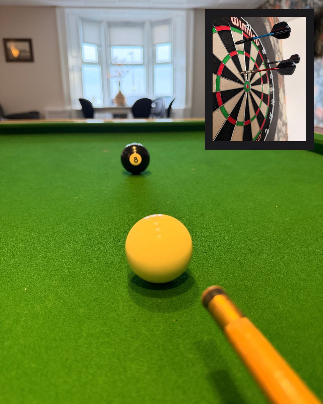 The Norton games room with pool table and darts.
